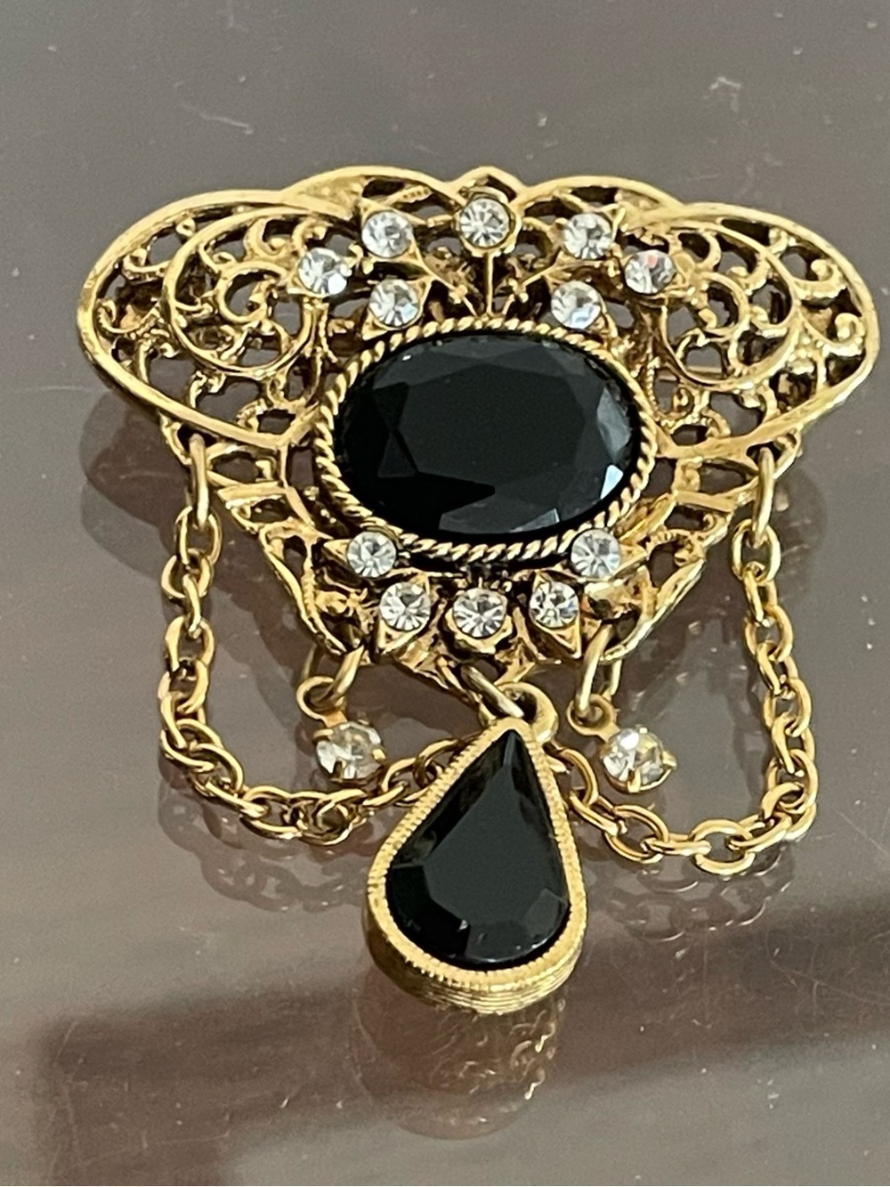 1928 Gold-Tone Filigree Brooch with Black Stones and Clear Crystals